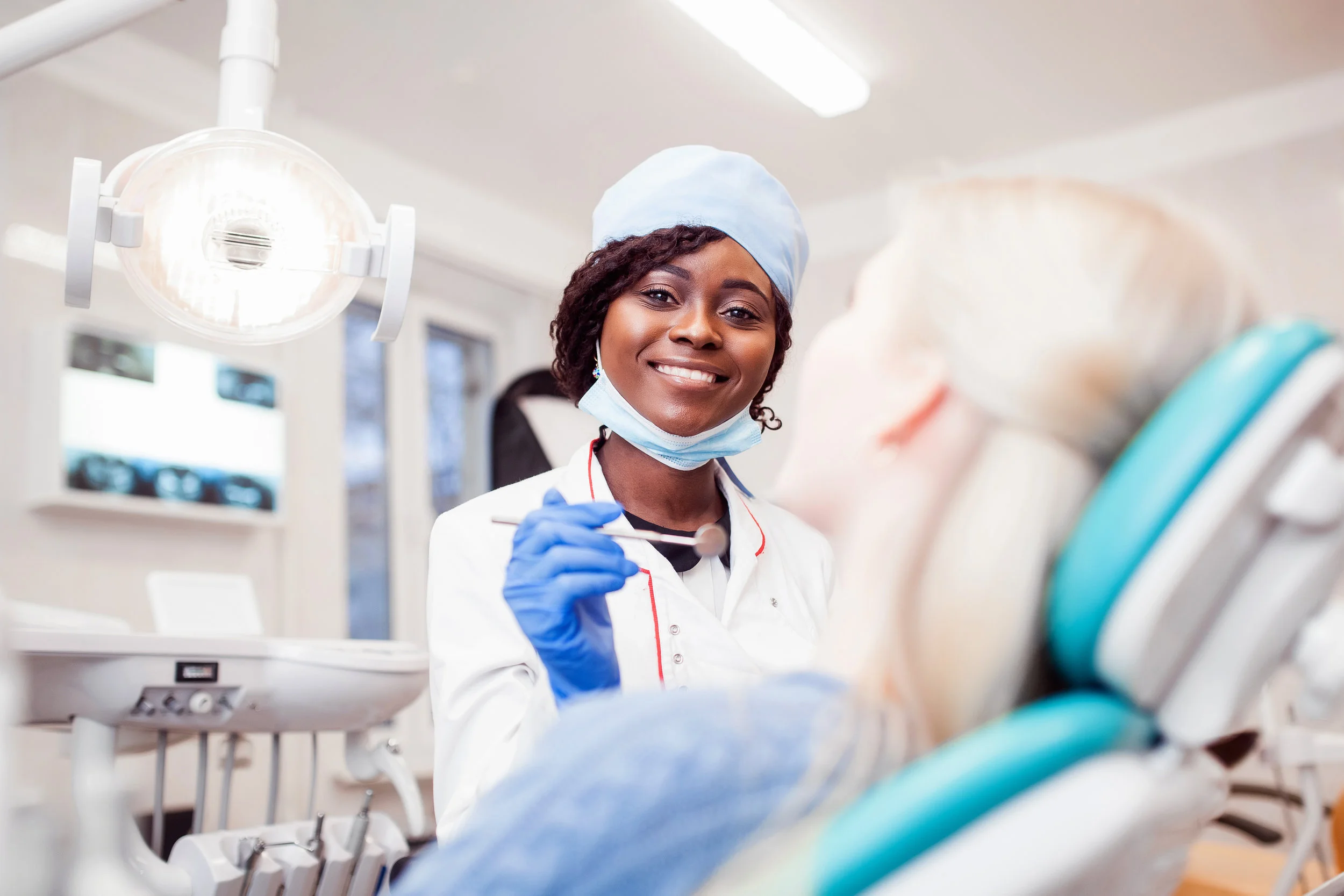 Dental professionals reading practice resources